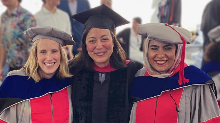 Image of Delia Wendel (center) with Silvia Danielak and Asmaa El Gammal at their doctoral hooding, commencement 2023