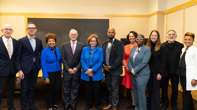 Group photo of Valerie Jarrett, Rafael Reif, Hashim Sarkis, Nicholas de Monchaux, Karilyn Crockett, Holy Harriel, and other members of the MIT community