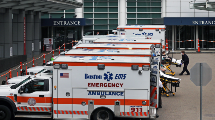An EMS crew wheels in a patient to Massachusetts General Hospital from their ambulance in Boston on Apr. 8, 2020. Transportation of goods and services procured by the health sector account for a large amount of carbon emissions in health care. Photo: Jim Davis/Boston Globe via Getty Images