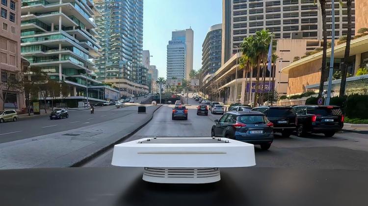 An image taken from the roof of a car shows the Flatburn device in the field, driving through Beirut