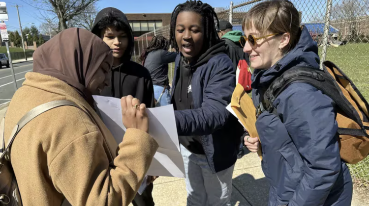 MIT graduate students Mena Mohamed (left) and Olivia Fiol (right) toured the Mill Creek neighborhood with Alain Locke School students Zarif Islam (rear left) and Zekih Presley (rear right) in March 2024. Their classes partnered to learn more about Mill Creek history and preserve the neighborhood.