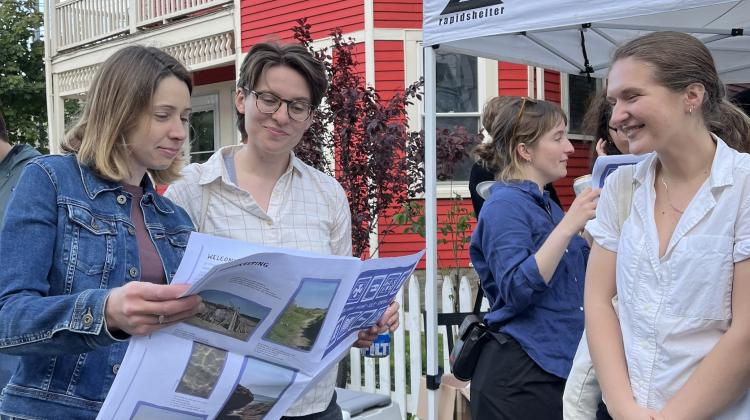 Two DUSP students read a copy of Silt