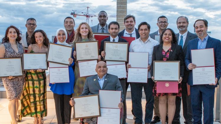 The 2023-2024 cohort of SPURS Fellows pose holding their certificates from their time at MIT