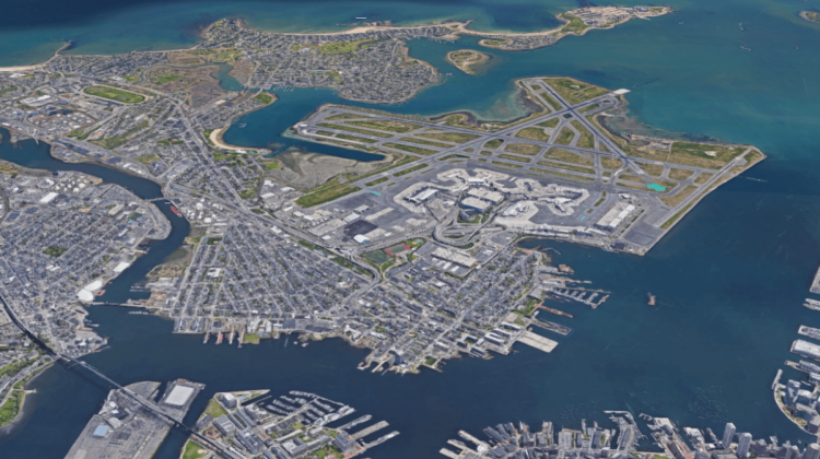 Arial view of East Boston, seen as centered in the image, while downtown Boston is mostly off the image and in the horizon is the Atlantic Ocean 