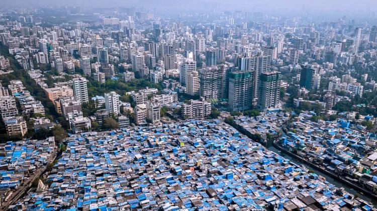 An image of Mumbai, showing informal settlements next to high rise buildings
