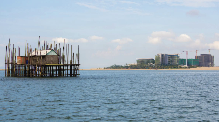 An offshore fishing post alongside the Forest City development on reclaimed land in the Strait of Johor. Photo Credit: Sera Tolgay, 2017