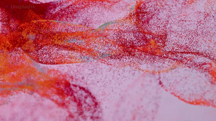 a close up of a red substance on a white surface