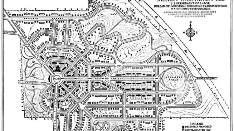 Black and white map featuring winding streets and little black squares representing homes.
