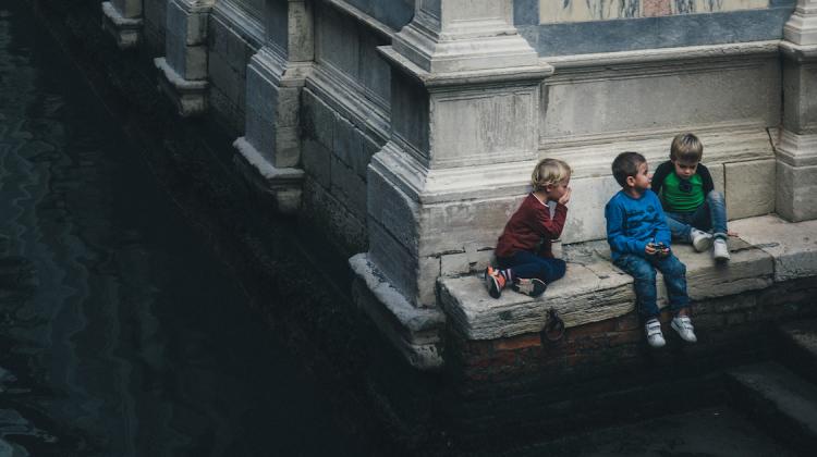 A group of kids plays in the footsteps of Santa Maria dei Miracoli in Cannaregio, where the church’s polychrome marbles meet the water of the canal. © Jiakun He, 2018